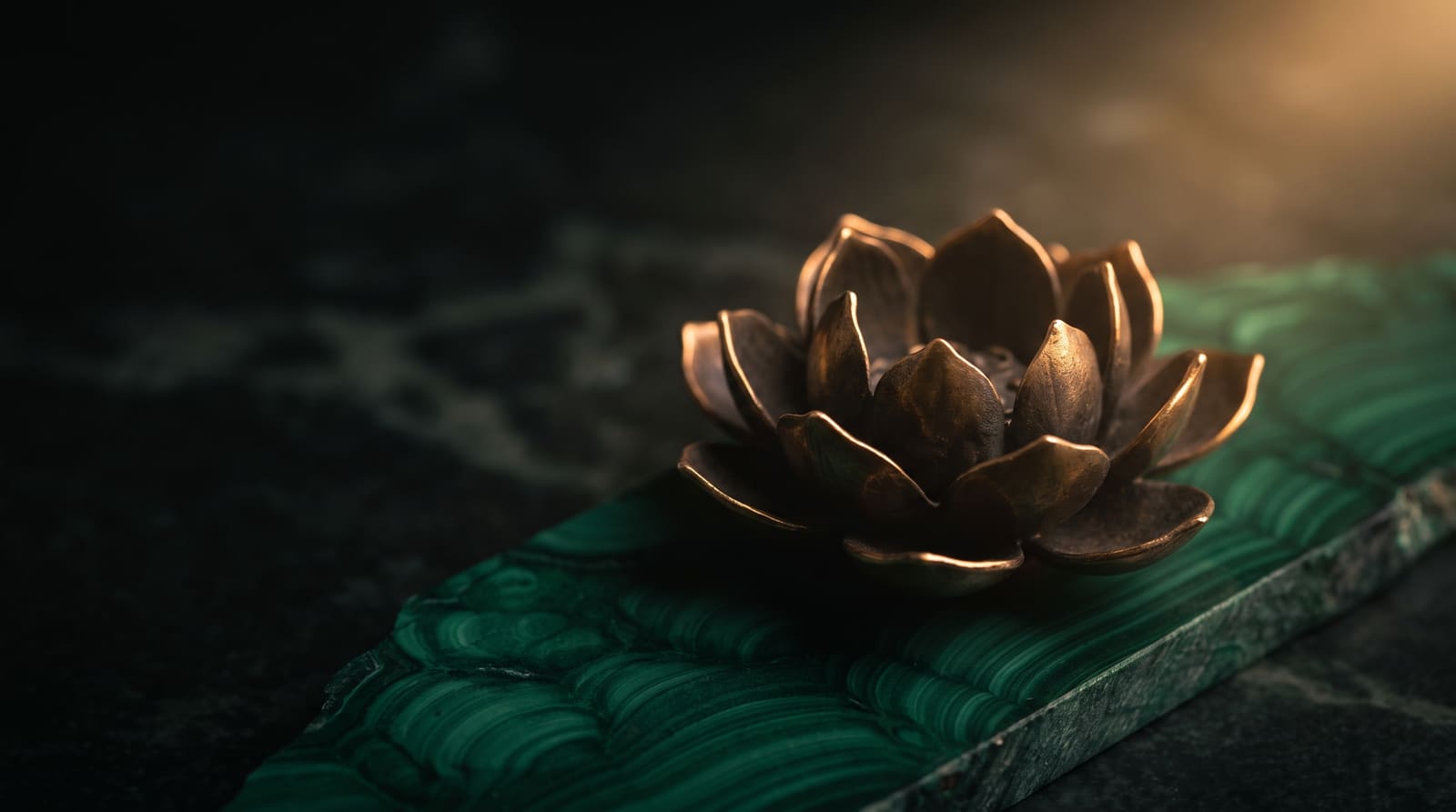 Bronze lotus on malachite